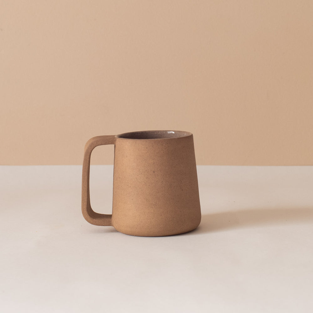 Beige ceramic tea mug